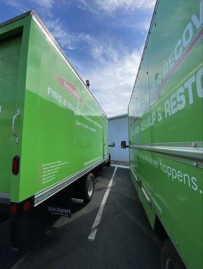 Two SERVPRO vehicles parked side by side